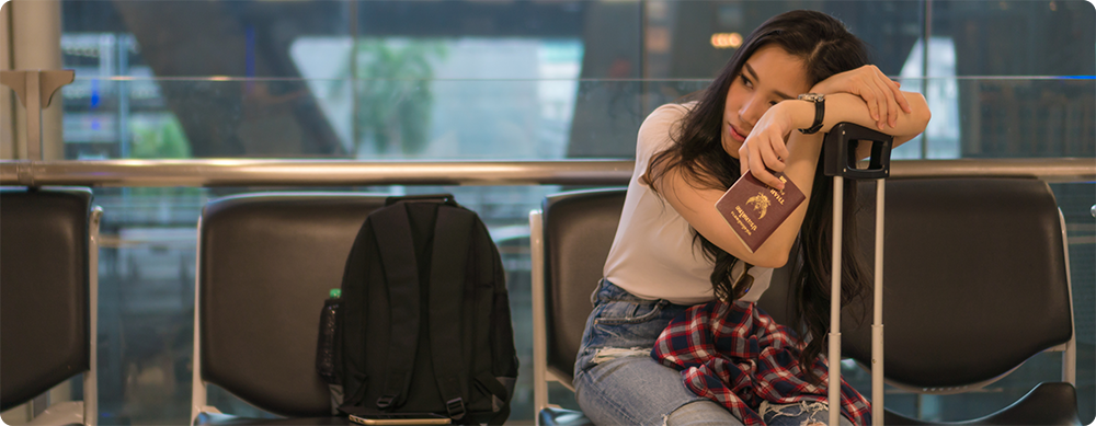 Lady Waiting at the Airport - International Travel Assistance Service